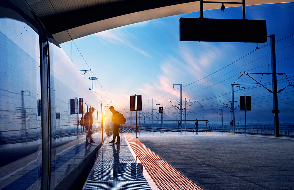train stop at railway station with sunset