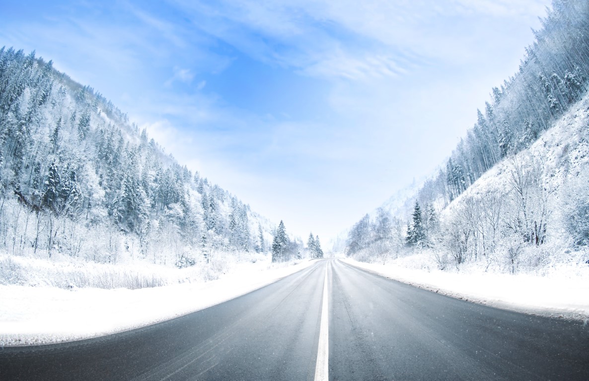 Country road in snowy winter day